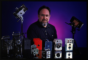 Ken Riley among his camera collectibles